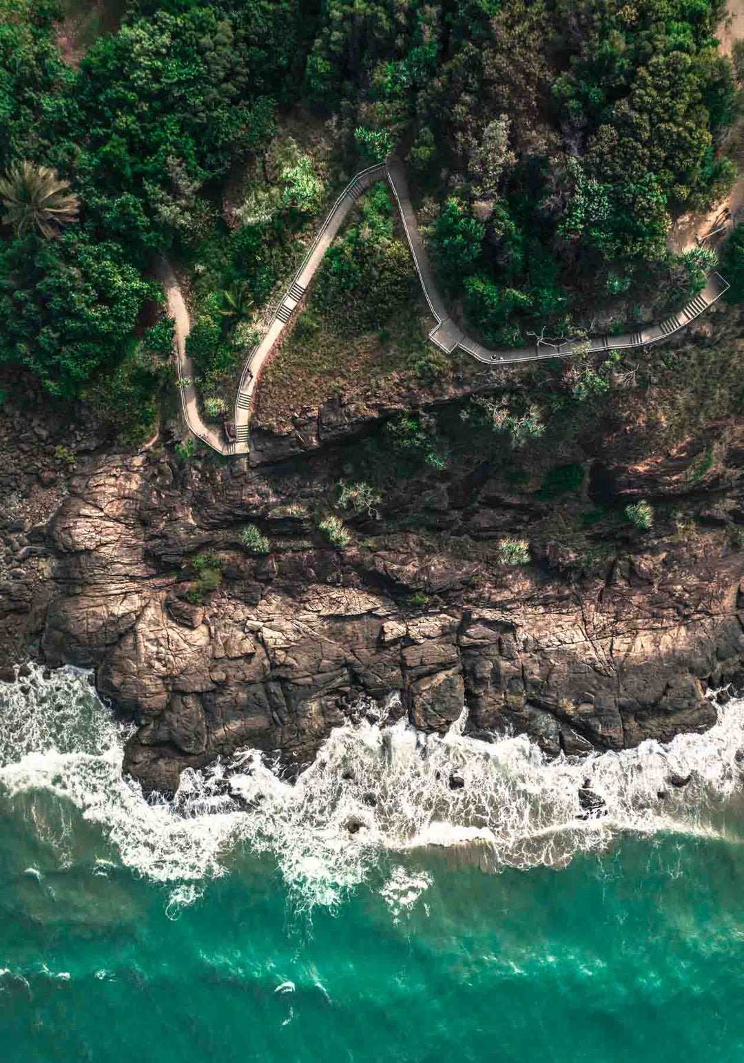 aerial photograph flagstaff hill port douglas crashing waves and walking trail at first light